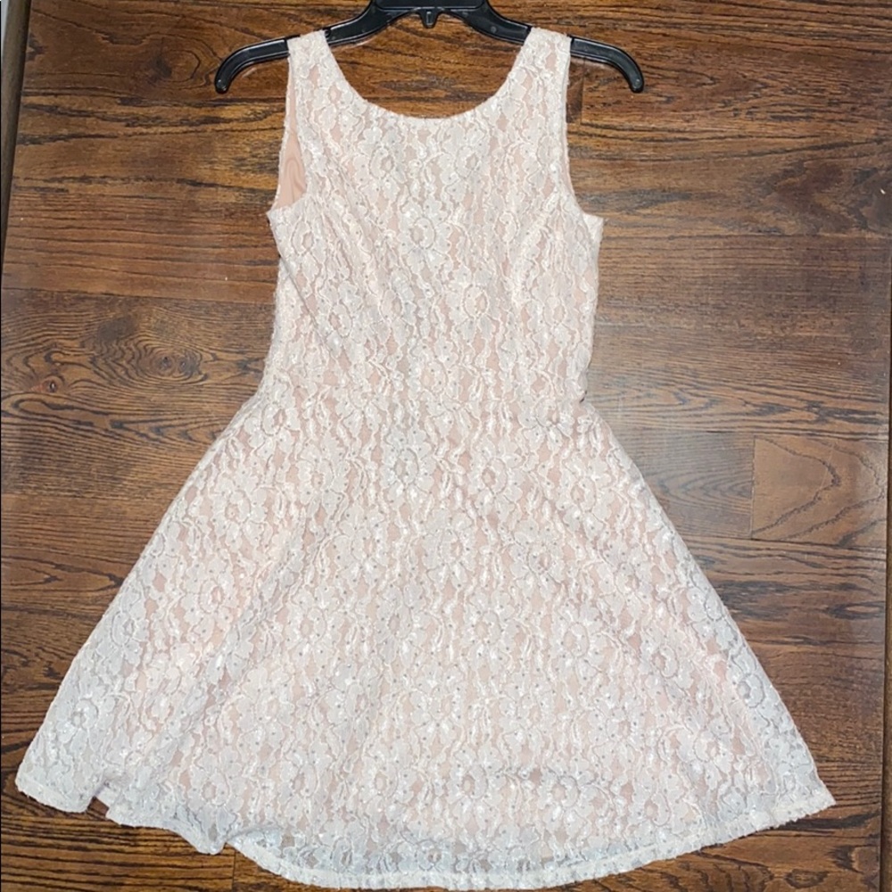 Blush color sparkly juniors dress.